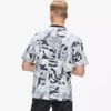 Avslappnad T-shirt med monogram över hela plagget Avslappnad T-shirt med monogram över hela plagget