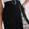 KJOL MED PLISSERADE DETALJER KJOL MED PLISSERADE DETALJER