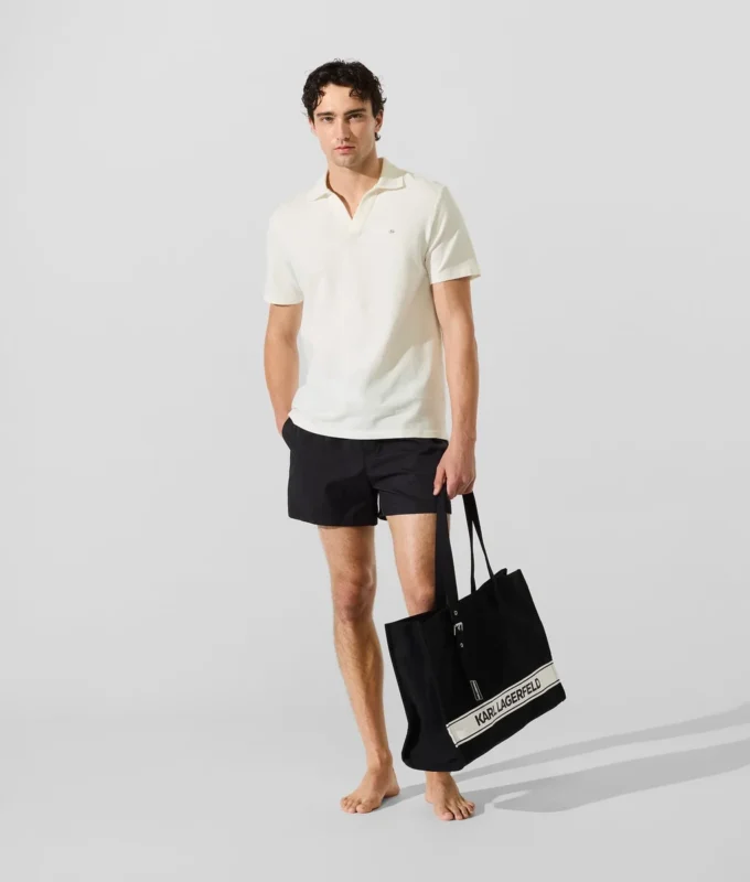 Polo med monogramnål Polo med monogramnål