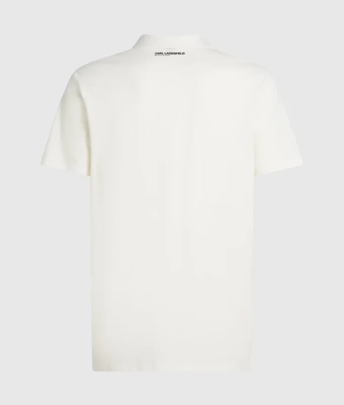 Polo med monogramnål Polo med monogramnål