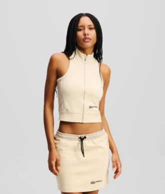 ÄRMÖS TOPP MED ZIP-FRONT