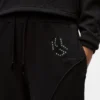Sweatpants med nitar och monogram