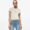 T-shirt med nitar och monogram T-shirt med nitar och monogram